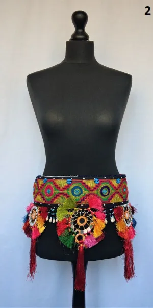 Embroidered Kuchi tassel belt with natural cowrie shells, colorful sun medallions and tribal tassels