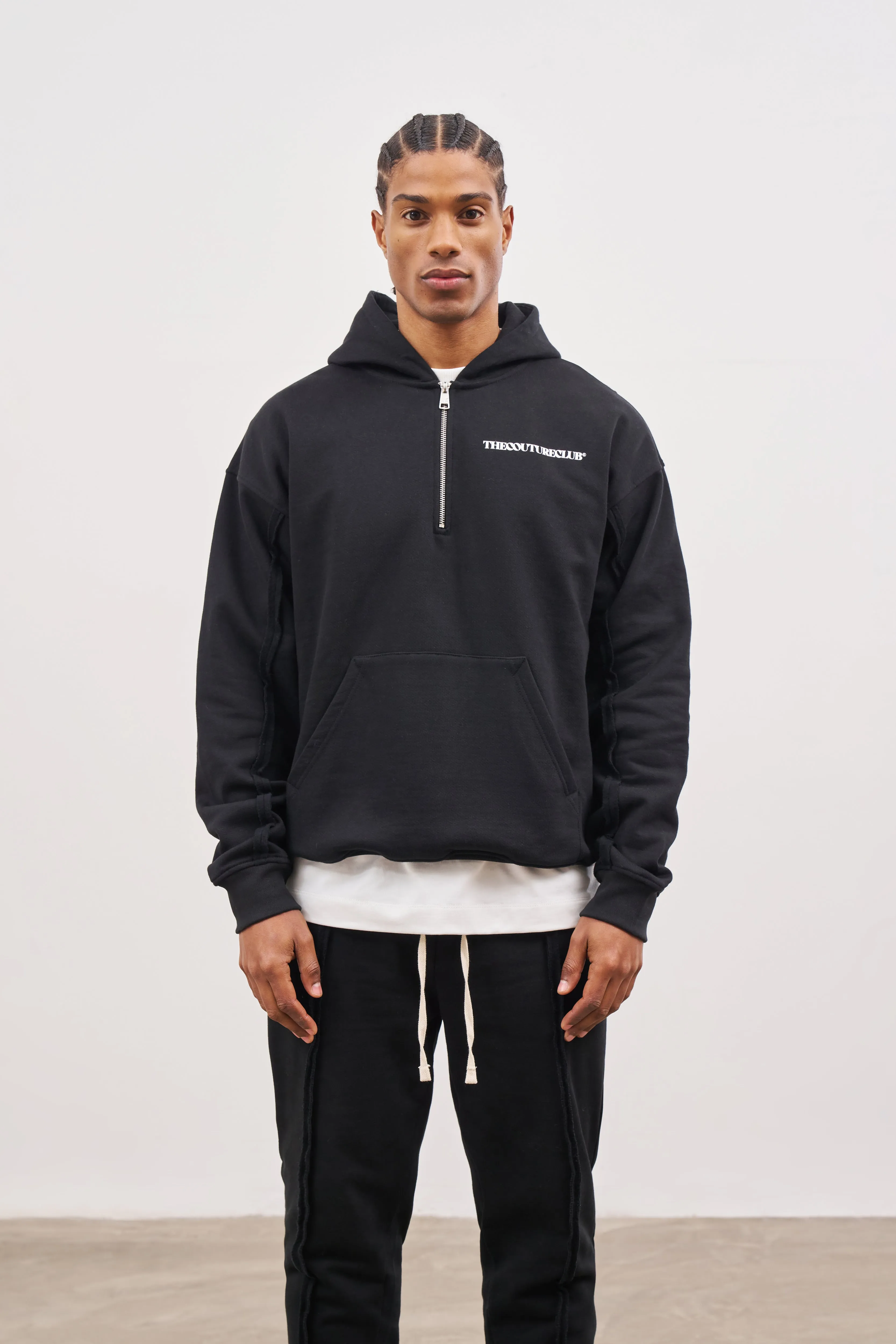 RAW SEAM QUARTER ZIP HOODIE - BLACK